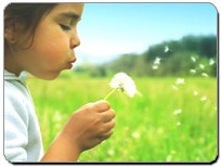 Girl-Blowing-flower